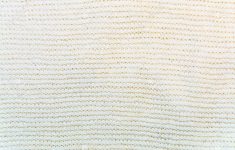 Knit Fabric Patterns The Beige Wool Knitted Fabric With Patterns Closeup Stock Photo