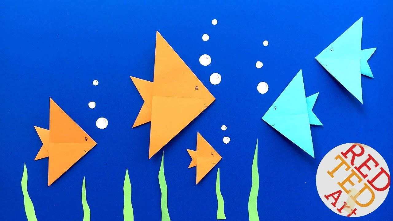 Оригами рыбка в старшей группе. Оригами рыбка. Оригами рыбка из бумаги. Оригами рыбки в аквариуме. Рыбка оригами для детей.